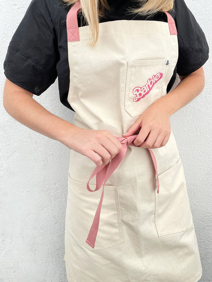 barbie x wallshoppe apron by hedley bennet 80 s logo