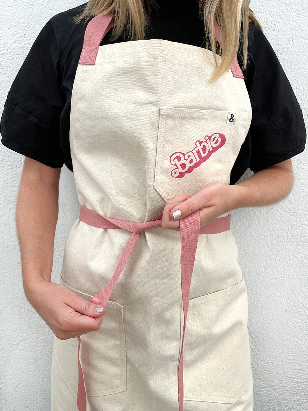 barbie x wallshoppe apron by hedley bennet 80 s logo