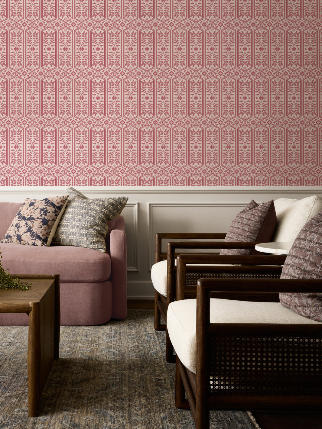 Pink damask wallpaper border with repeating floral lattice and vertical stripe panels.