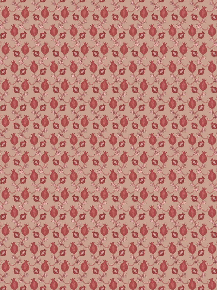 Blush clay wallpaper with small brick red pomegranate motifs in a dense ditsy grid