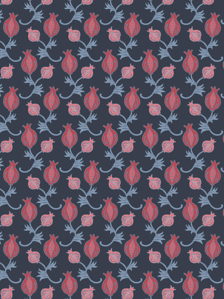 Close crop of red and dusty rose-pink pomegranate motifs on dark navy slate blue