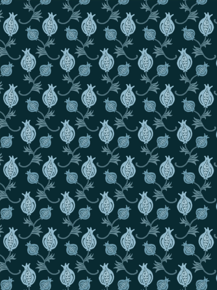 Close crop of pale ice blue pomegranate motifs on very dark teal petrol blue