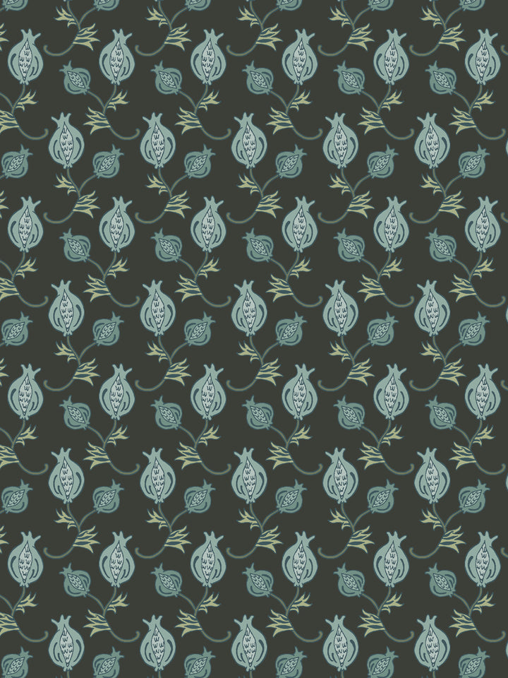 Close crop of soft sage and eucalyptus green pomegranate motifs on dark olive-charcoal