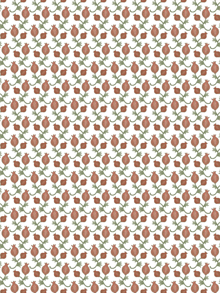 White wallpaper with small terracotta pomegranates and sage green leaves in a tight grid