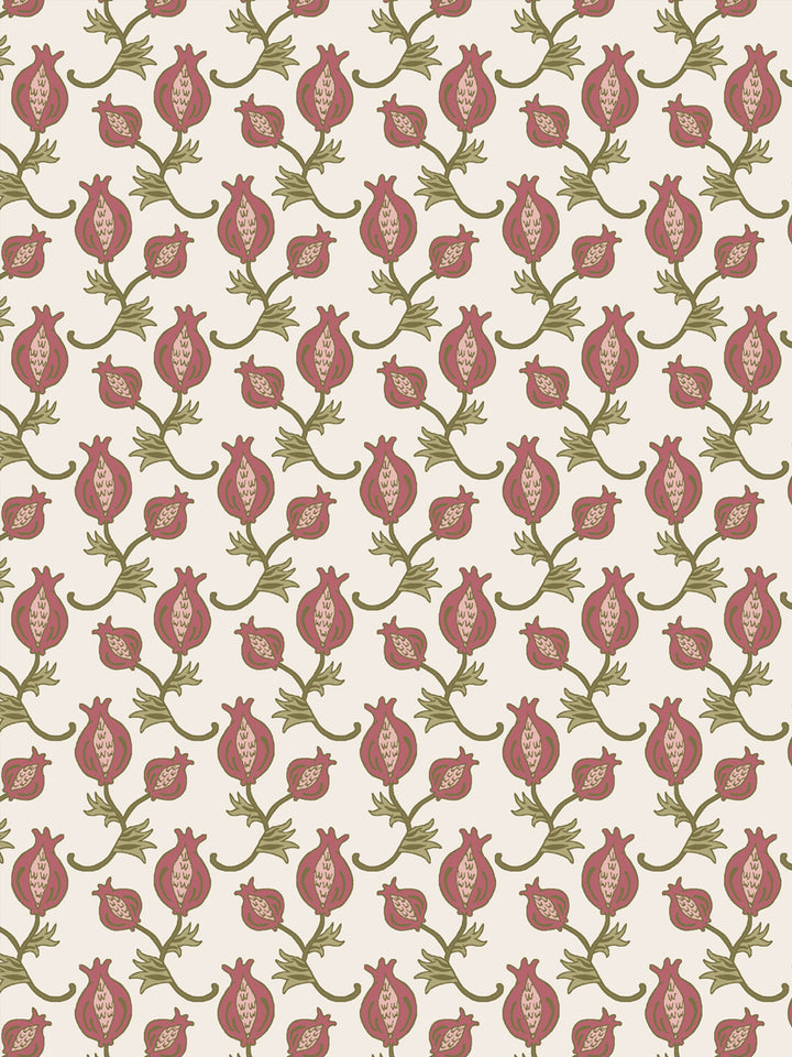 Close crop of dusty rose-red pomegranate motifs on warm cream
