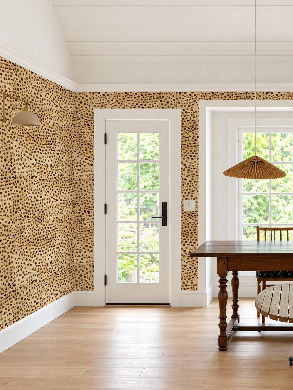 Cheetah print wallpaper with multi-colored spots covering an accent wall