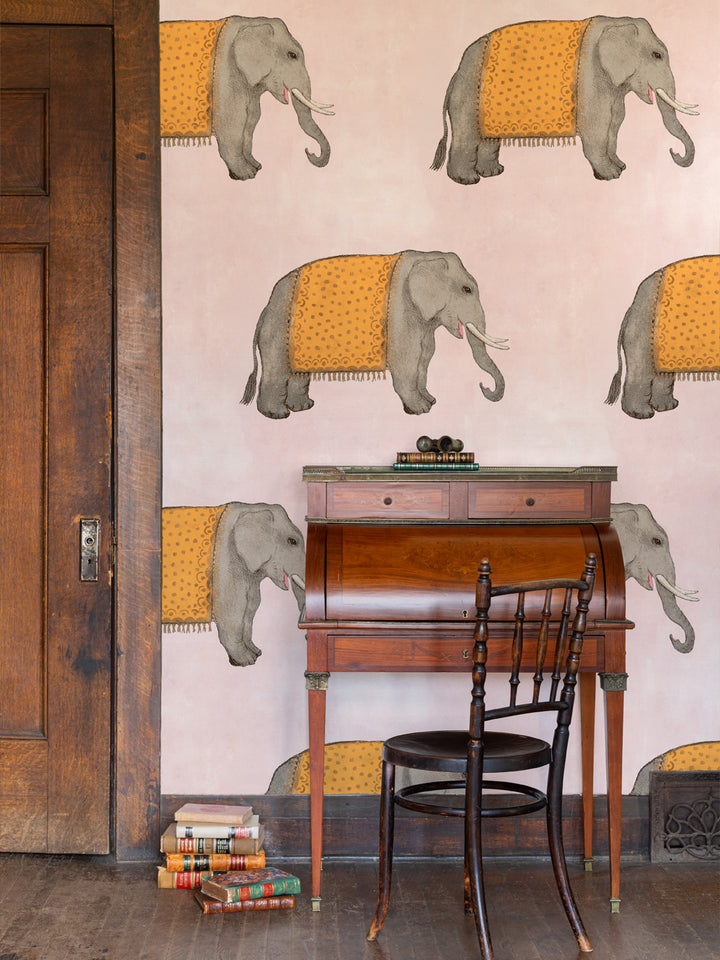 Elephant wallpaper pattern showing multiple gray elephants with orange patterned cloth