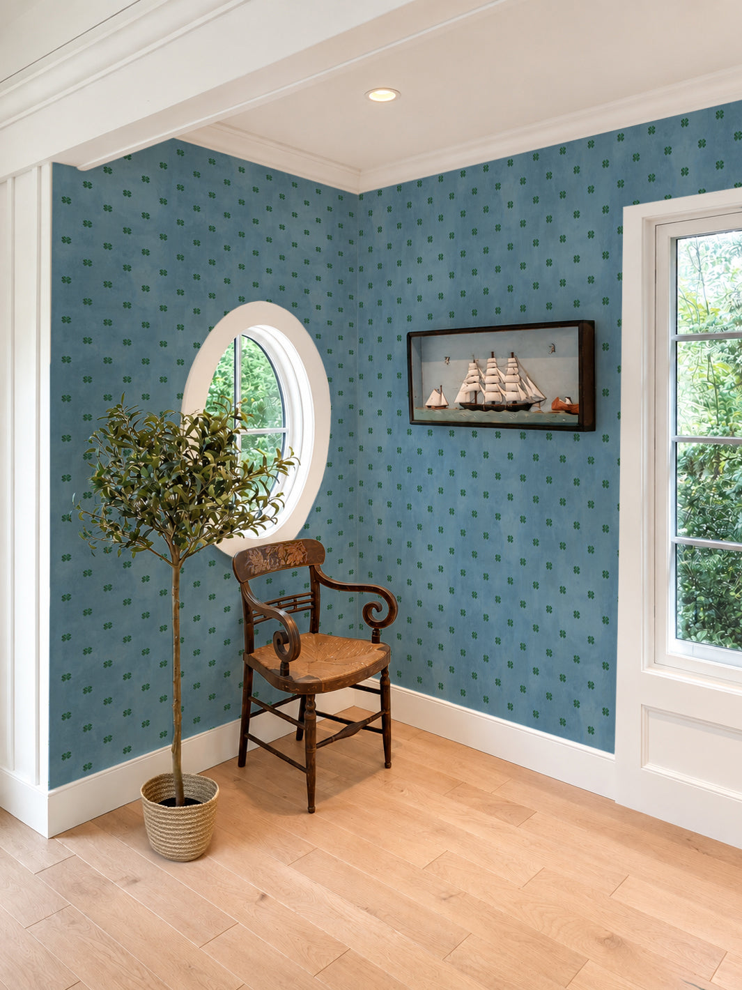 Cadet blue wallpaper with small green four-leaf clover pattern by Mary Maguire