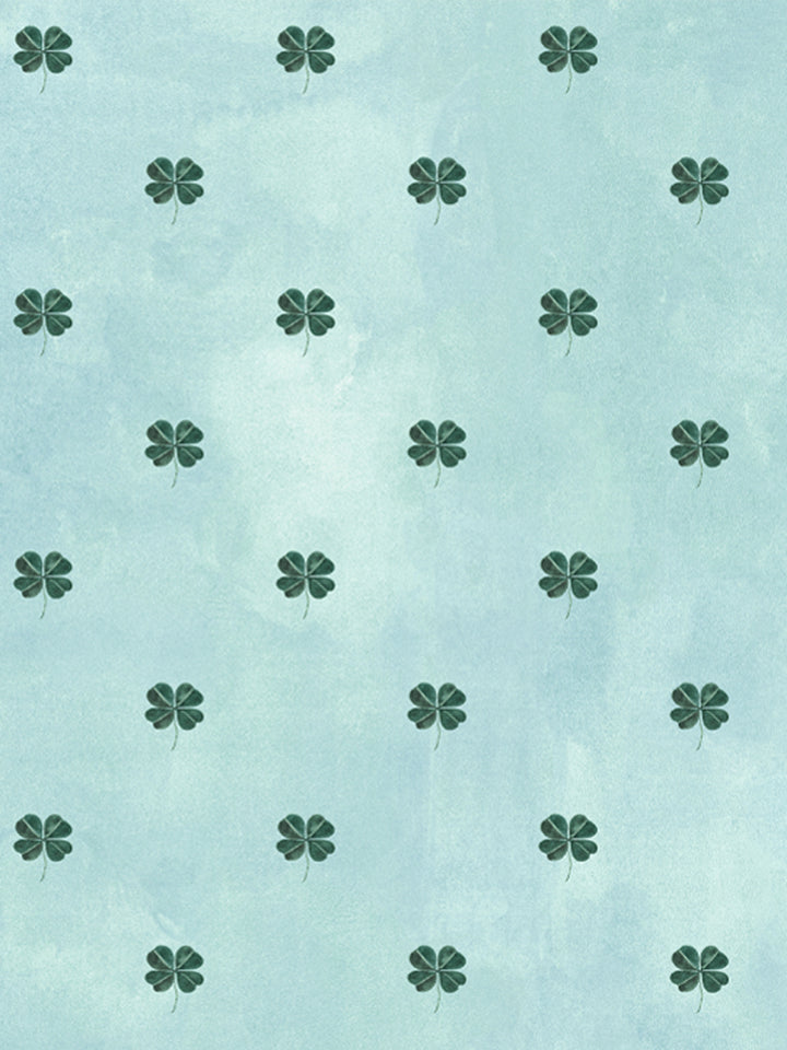 Light blue wallpaper with dark green four-leaf clover icons, evenly spaced repeating pattern