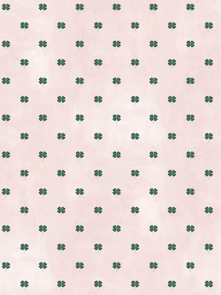 Blush wallpaper with small green four-leaf clover pattern repeat