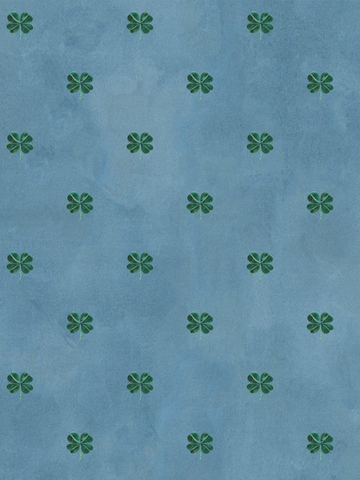 Clover-pattern wallpaper with spaced green four-leaf motifs on cadet blue background