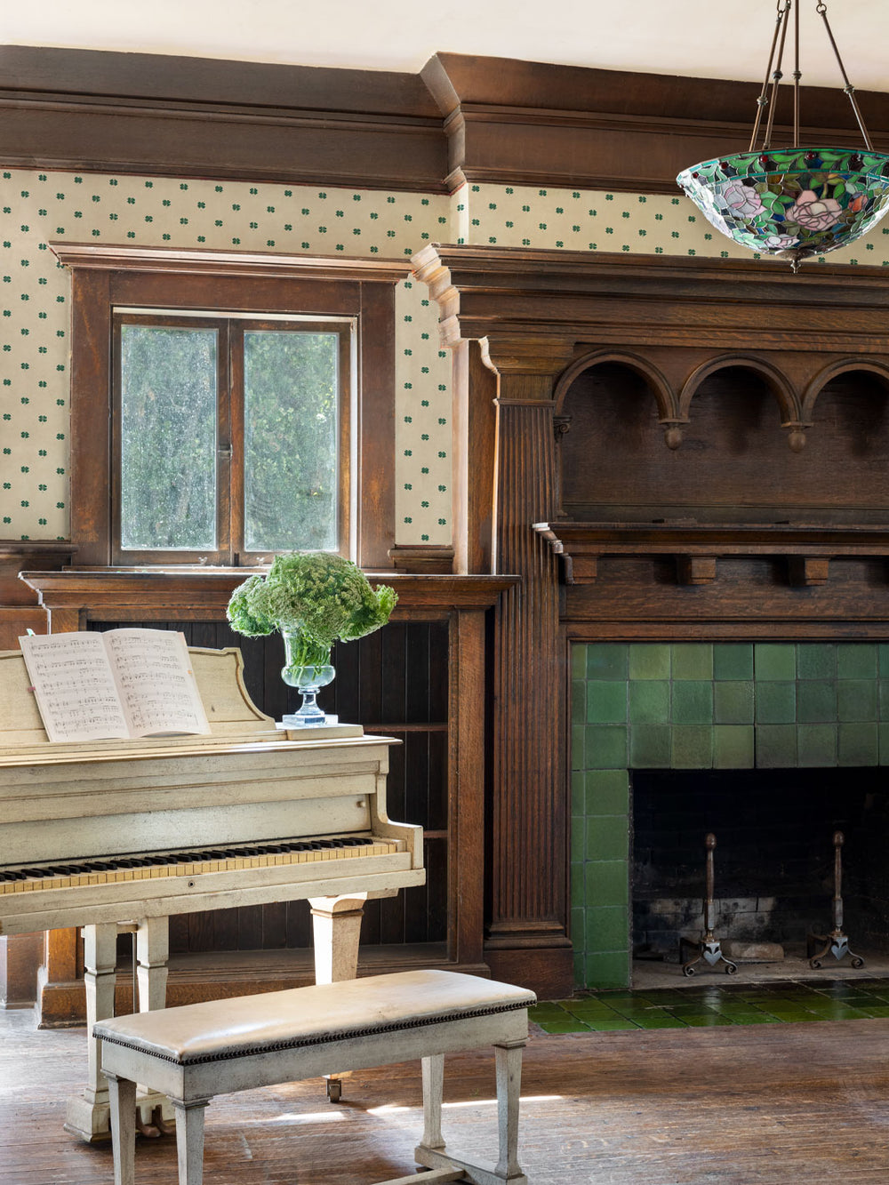 Four-leaf clover wallpaper on room wall, paired with blue check border