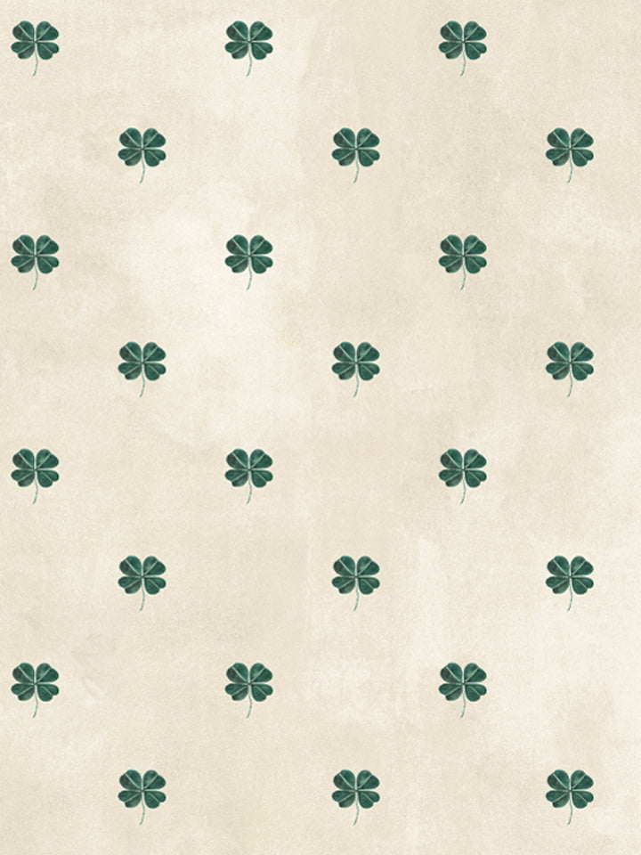 Four-leaf clover wallpaper with evenly spaced teal clover motifs on parchment