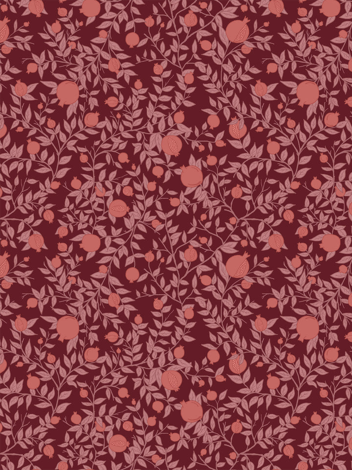 Pomegranate branch wallpaper with coral pink fruit and rose leaves on a deep merlot red ground