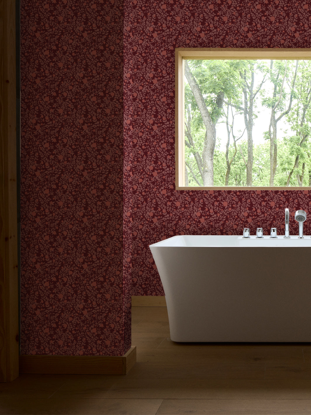 White freestanding tub and chrome faucet by a window, walls in merlot and coral pomegranate paper