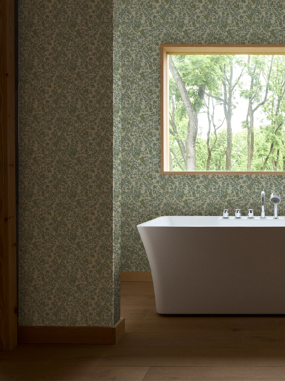 White freestanding tub and chrome faucet by a window, walls in pale green pomegranate paper