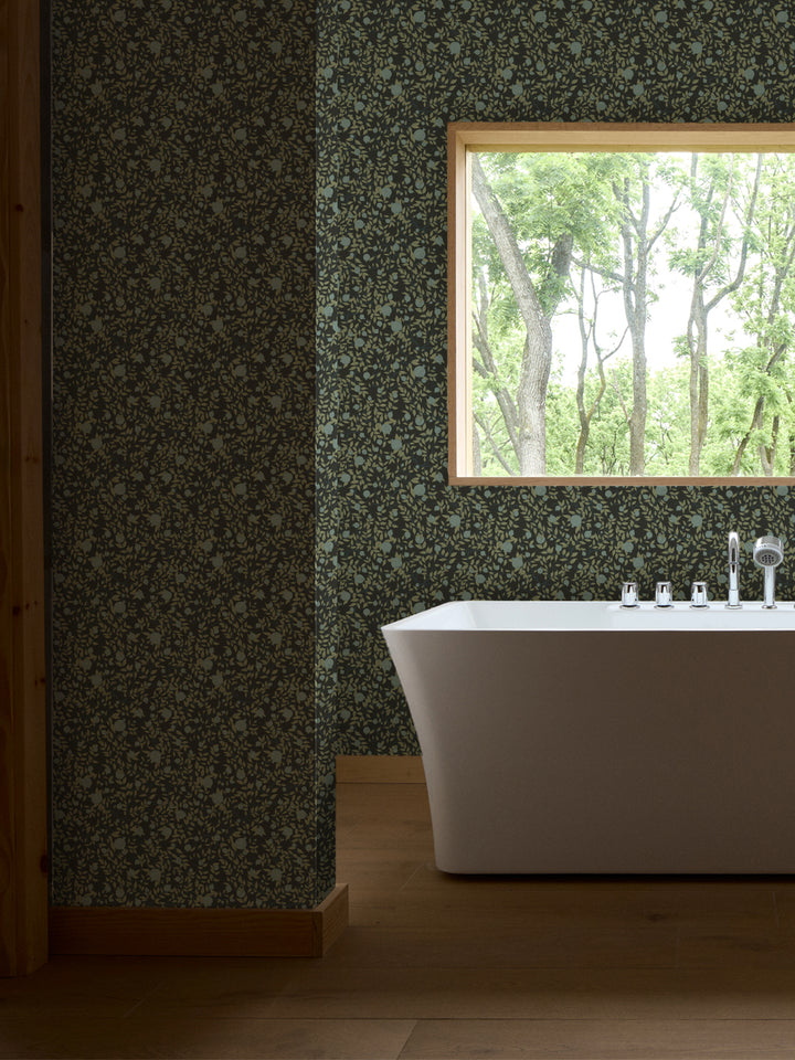 White freestanding tub and chrome faucet by a window, walls in near-black green pomegranate paper