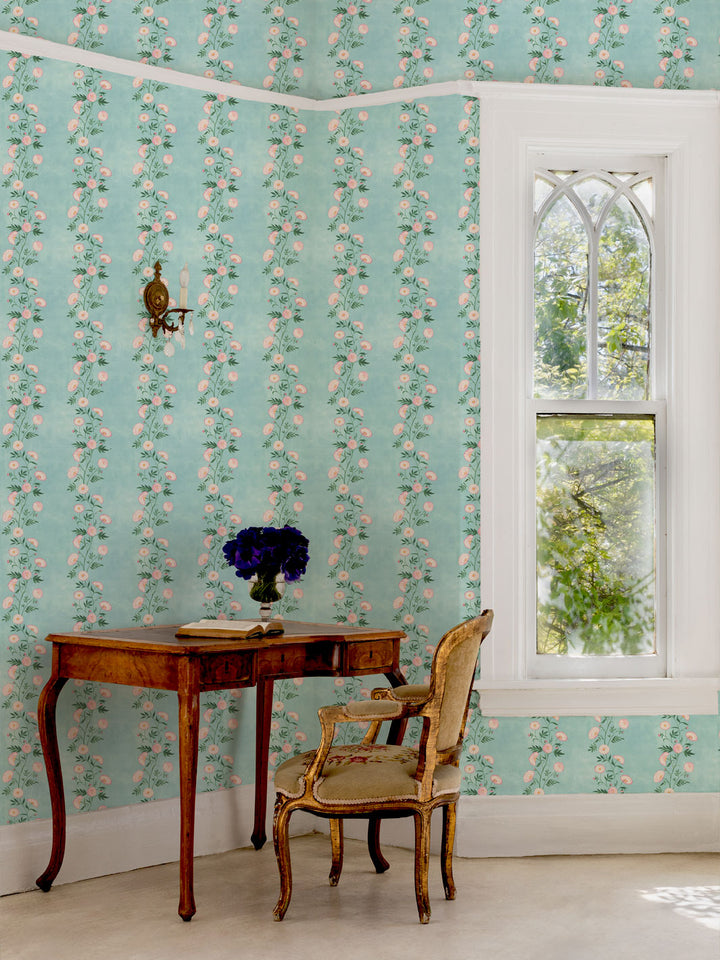 Floral stripe wallpaper covering the room wall with a window edge visible