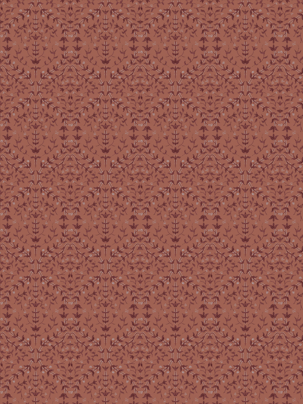 Close crop of deeper maroon-brown lily sprigs on muted terracotta clay