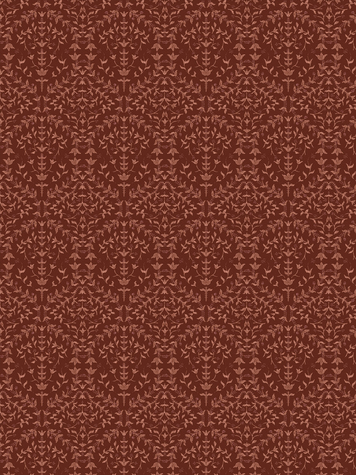 Close crop of muted terracotta-salmon lily sprigs on deep oxblood red-brown