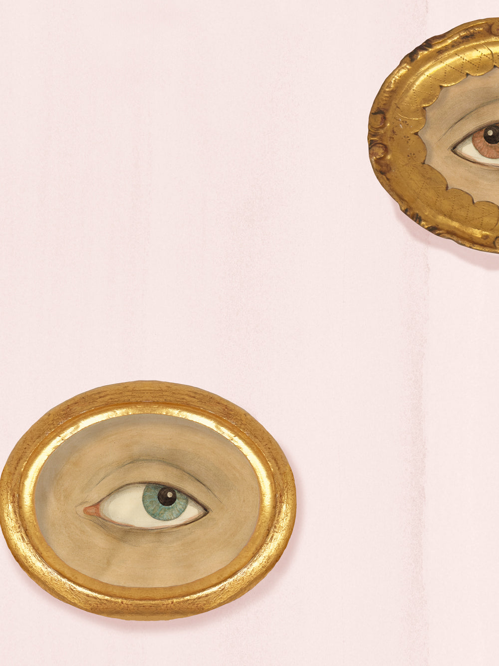 Close-up of blush wallpaper showing a gold oval frame around a painted sea-green eye