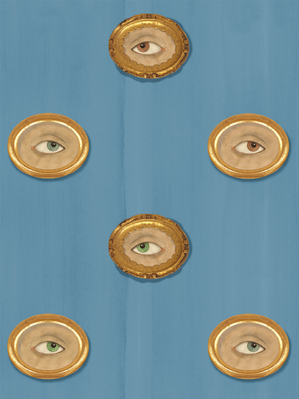 Dusty steel blue wallpaper with gilt oval frames holding painted eyes in brown, green and blue-gray