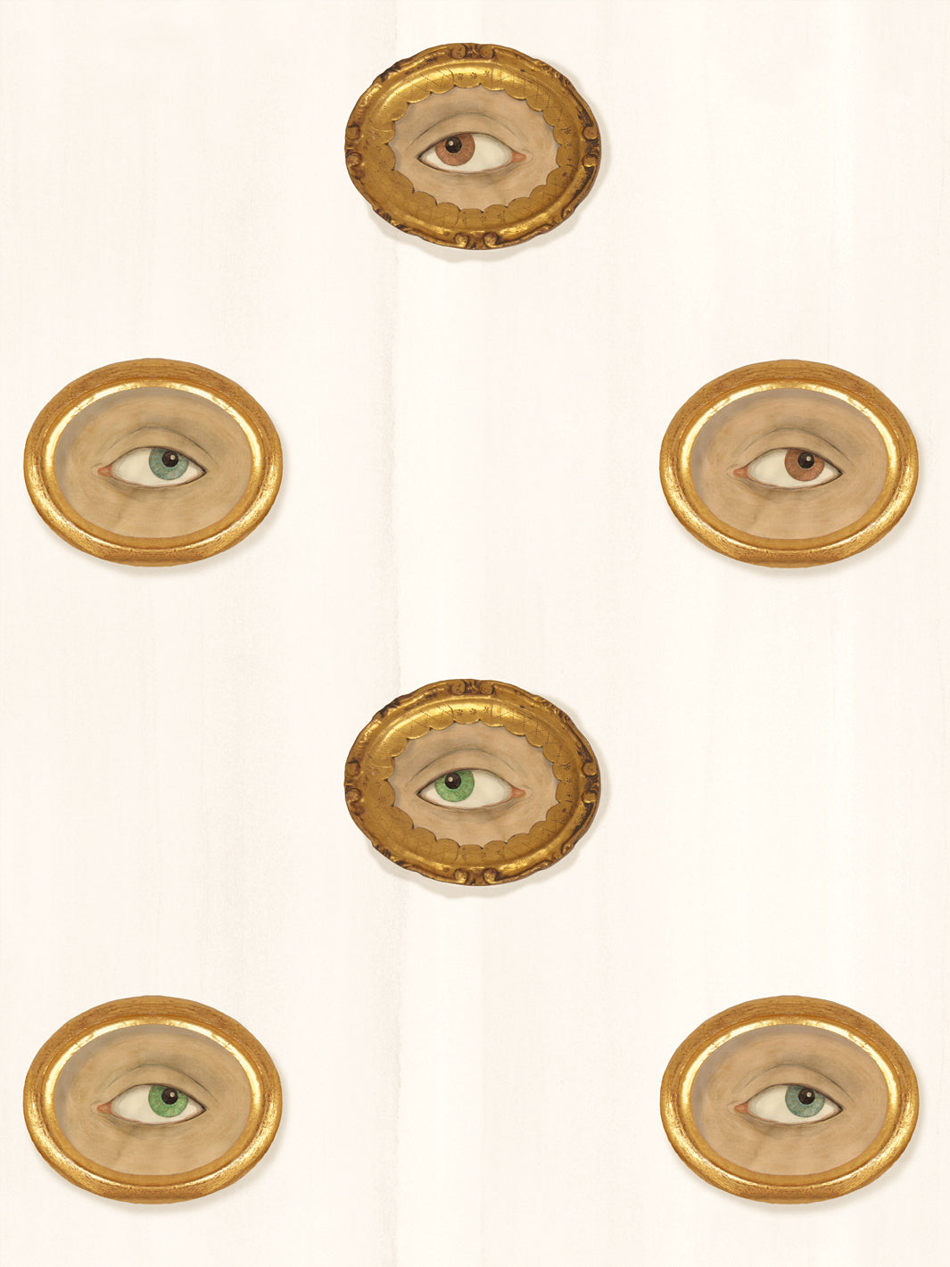 Warm ivory wallpaper with gilt oval frames holding painted eyes in brown, green and blue-gray