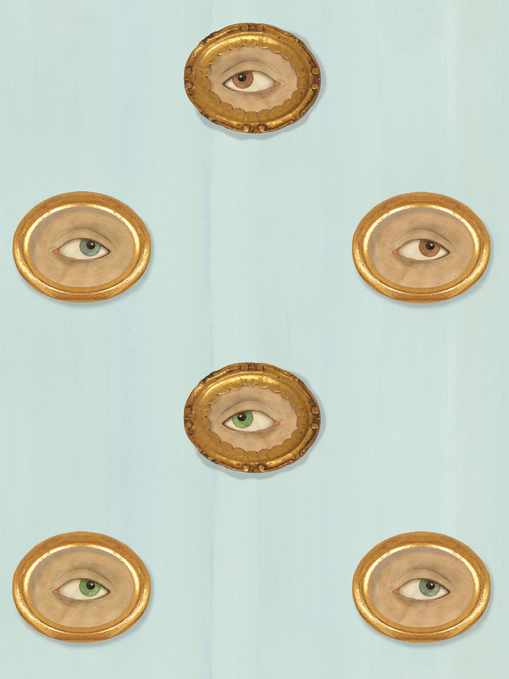 Blue wallpaper with repeating gold oval eye frames