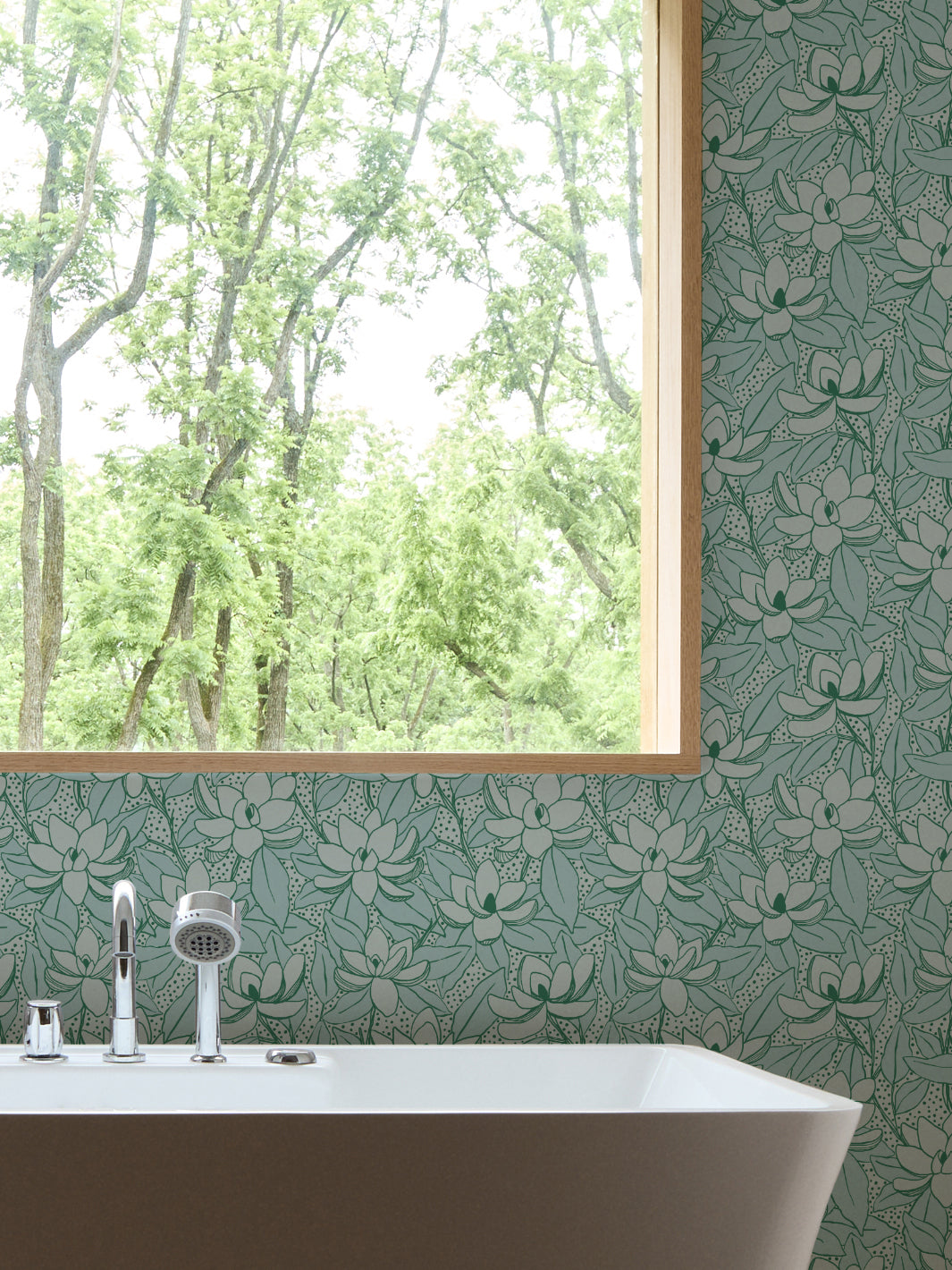 Aegean Kelp Magnolias wallpaper in a bathroom with a white freestanding tub and oak-framed window