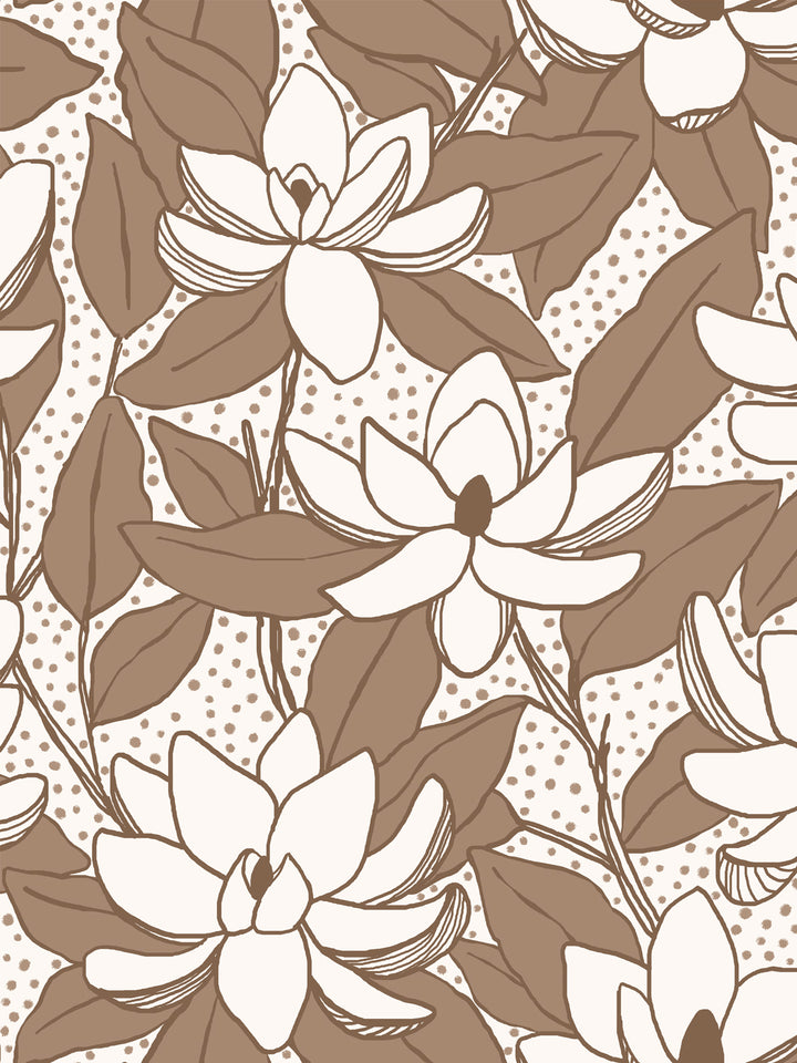 Close crop of off-white flowers magnolia blooms on warm ivory cream