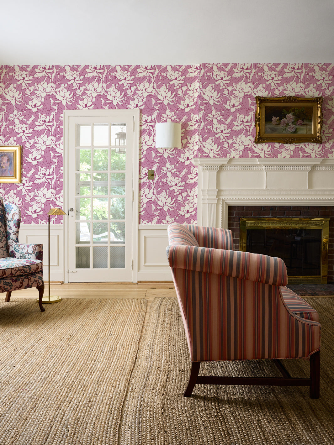 Linen Mulberry Magnolias wallpaper in a living room with striped settee, white fireplace and jute rug