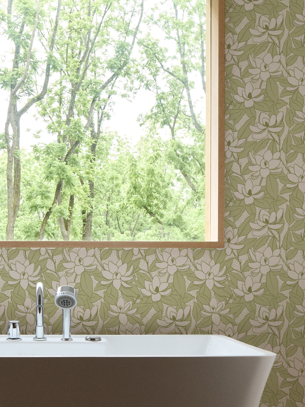 Linen Zest Magnolias wallpaper in a bathroom with white freestanding tub and oak-framed window
