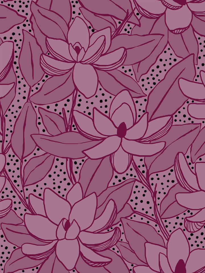 Close crop of lighter mauve-pink flowers magnolia blooms on deep wine-plum magenta