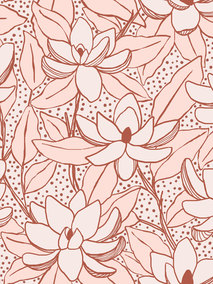 Close crop of pale blush-cream flowers magnolia blooms on soft blush pink