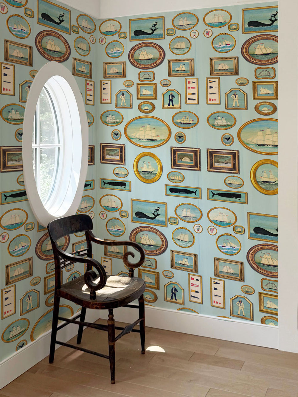 Nautical frames wallpaper covering walls, repeating blue sailing and portrait frames