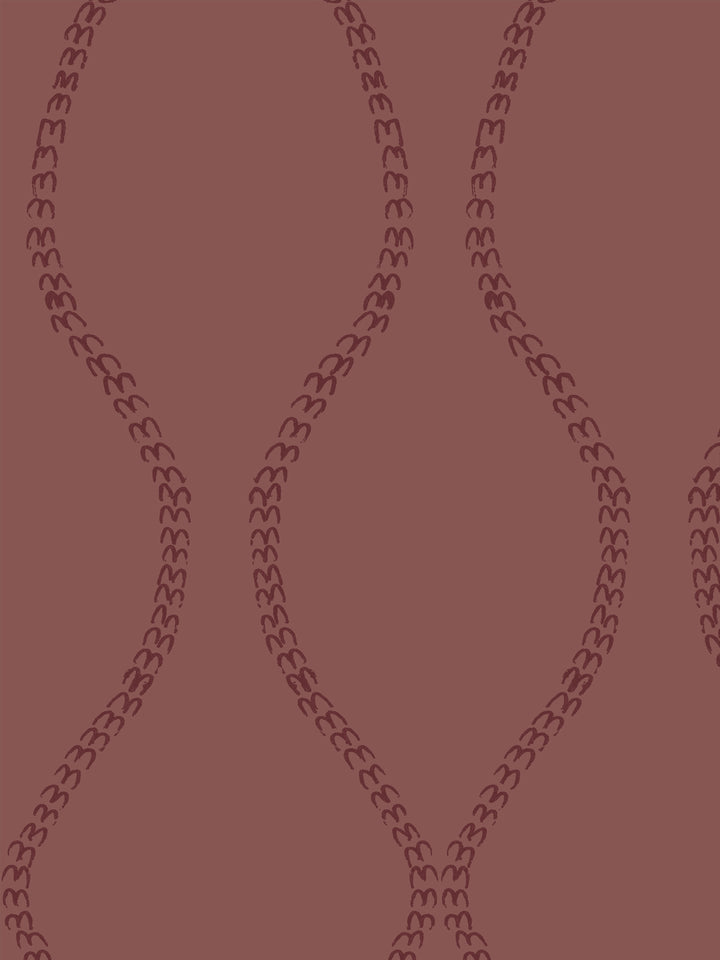 Close crop of dark maroon a leaf-chain trellis on dusty brick red