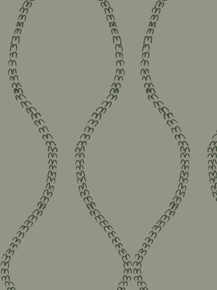 Close crop of dark forest green a leaf-chain trellis on grey-green olive