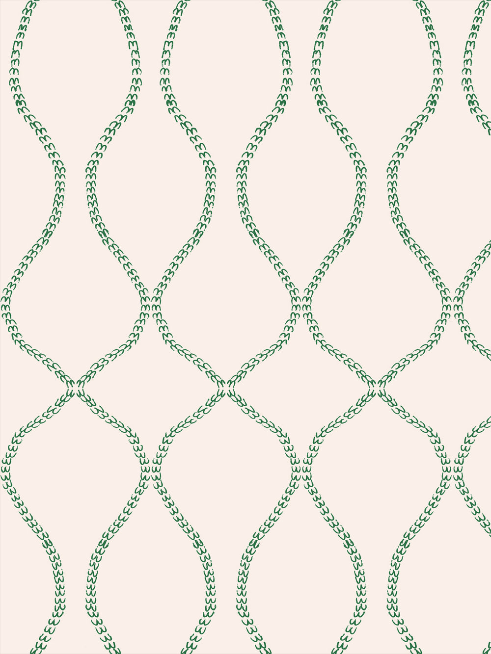 Emerald green leaf-chain trellis on a pale blush cream ground