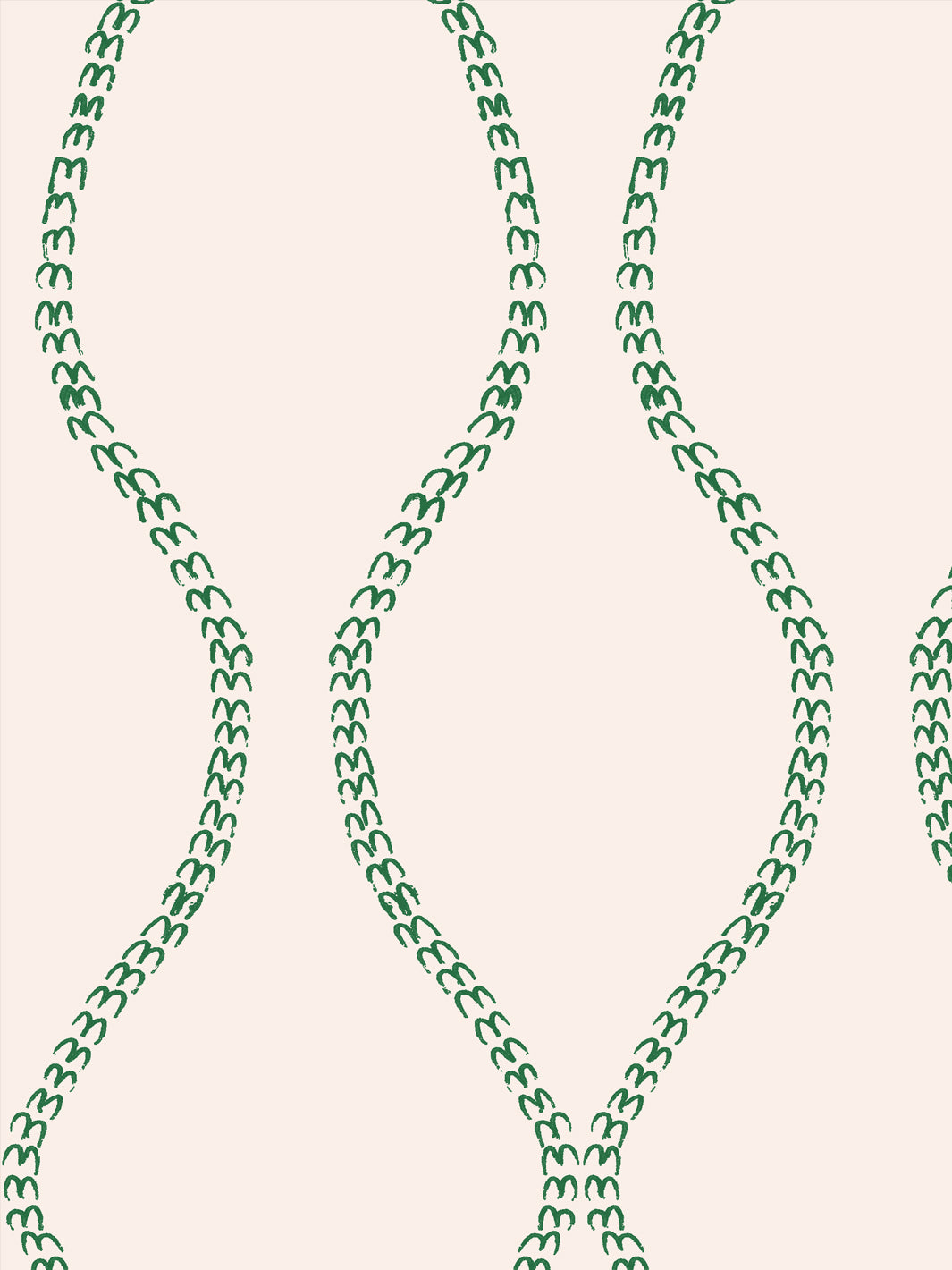 Close crop of saturated emerald green a leaf-chain trellis on pale blush-tinted cream