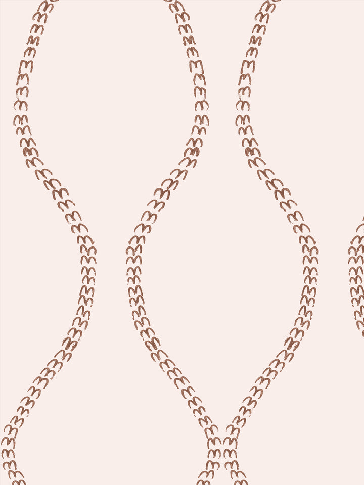 Close crop of russet copper brown a leaf-chain trellis on pale blush cream