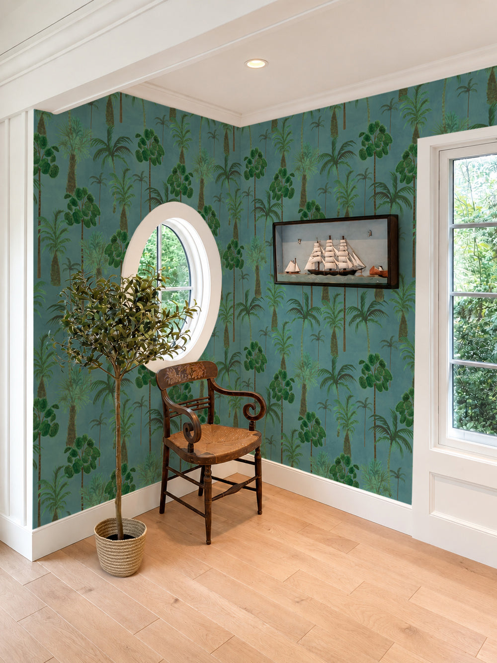 Tropical palm leaf wallpaper pattern in green, with repeating foliage motifs