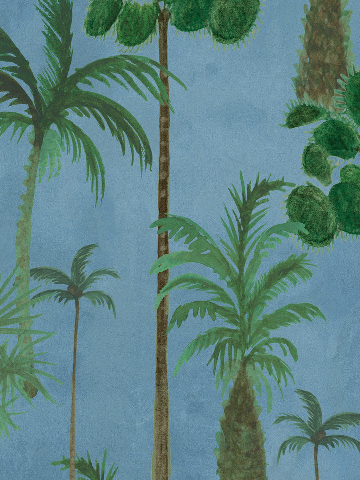 Tropical palm forest wallpaper pattern with layered green leaves on blue.