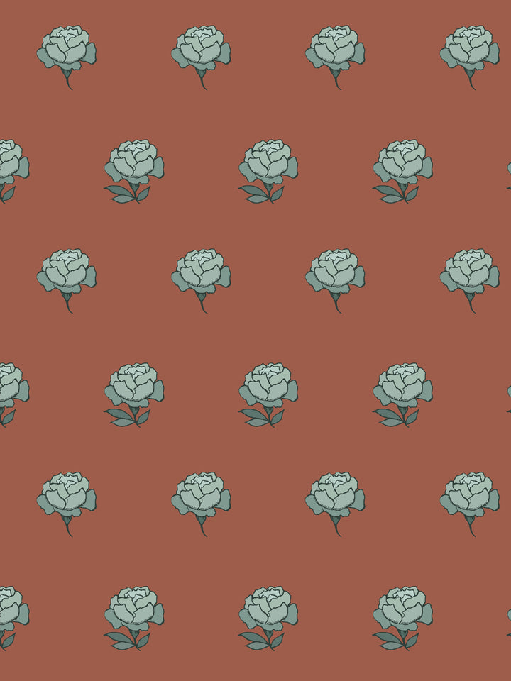 Close crop of pale seafoam blue green peony heads on warm brick rust terracotta
