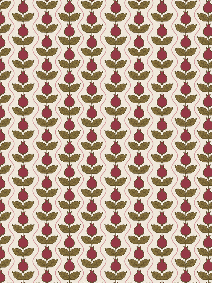 Close crop of deep crimson-wine pomegranate columns on warm cream