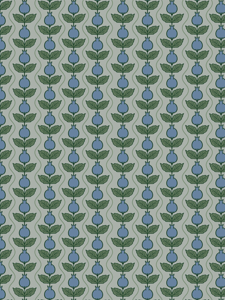 Close crop of slate-blue pomegranate columns on soft grey-sage