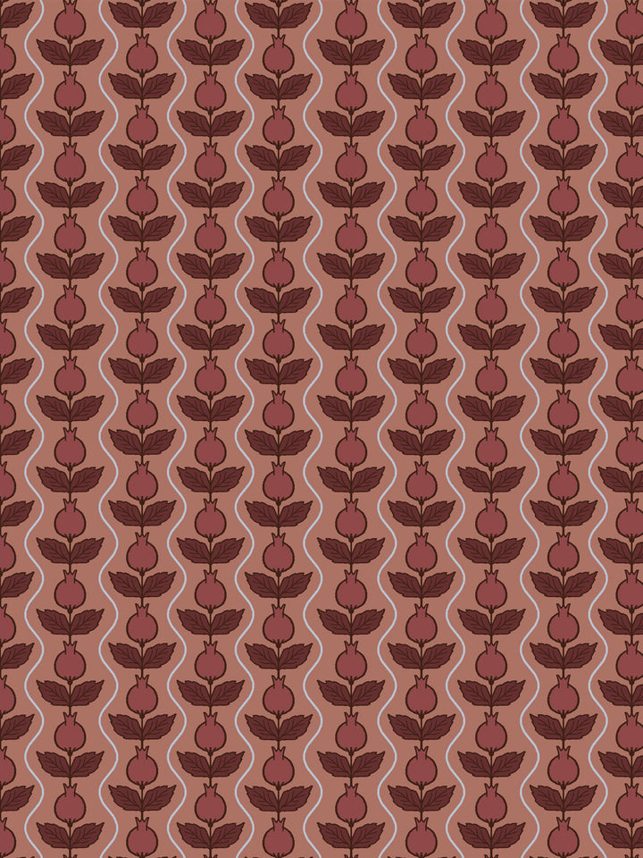 Close crop of deep brick-wine pomegranate columns on muted terracotta clay-rose