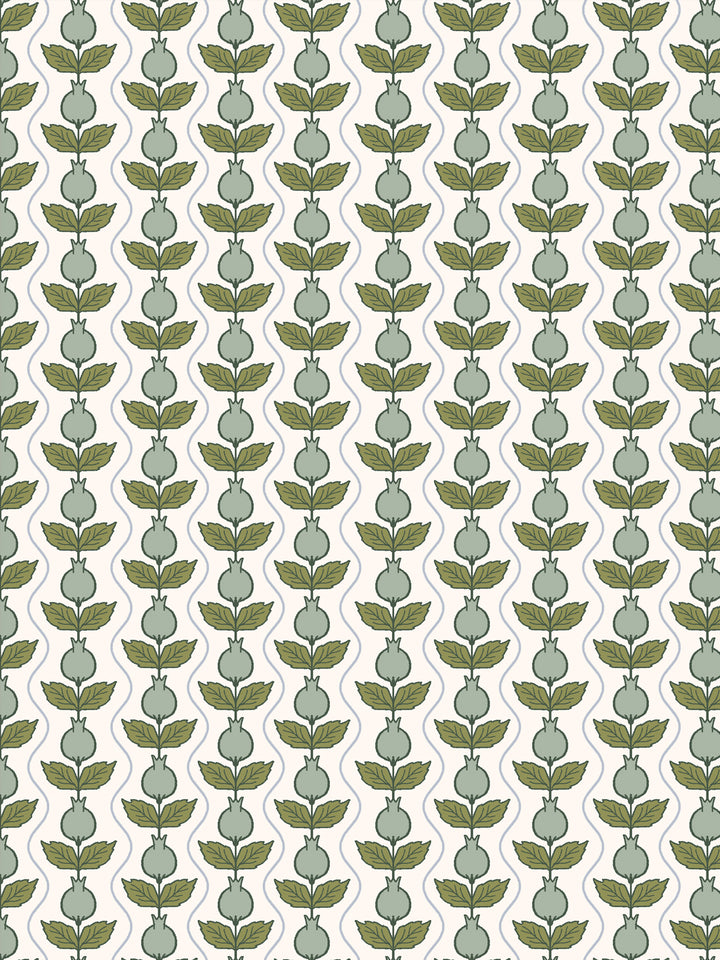 Close crop of soft sage-green pomegranate columns on warm cream