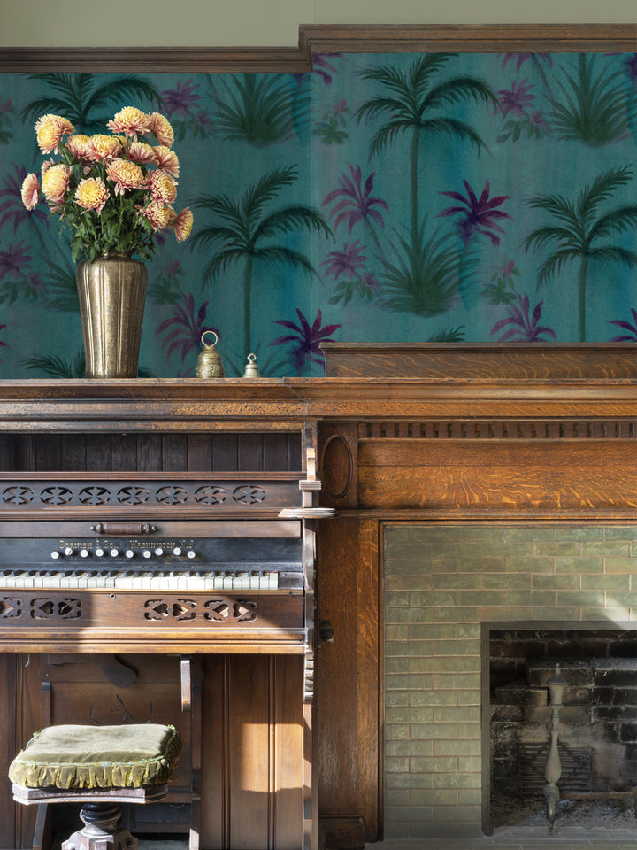 Wallpapered wall with teal background and purple/pink palm tree repeat pattern