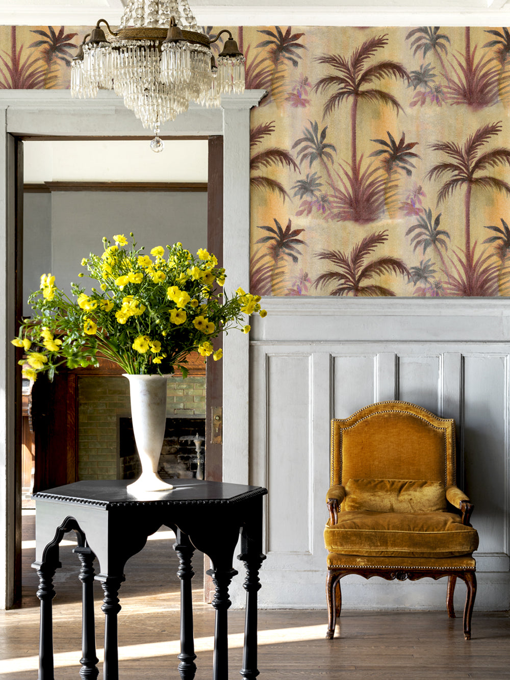 Tropical palm leaf wallpaper on wall in tan, purple, and brown tones