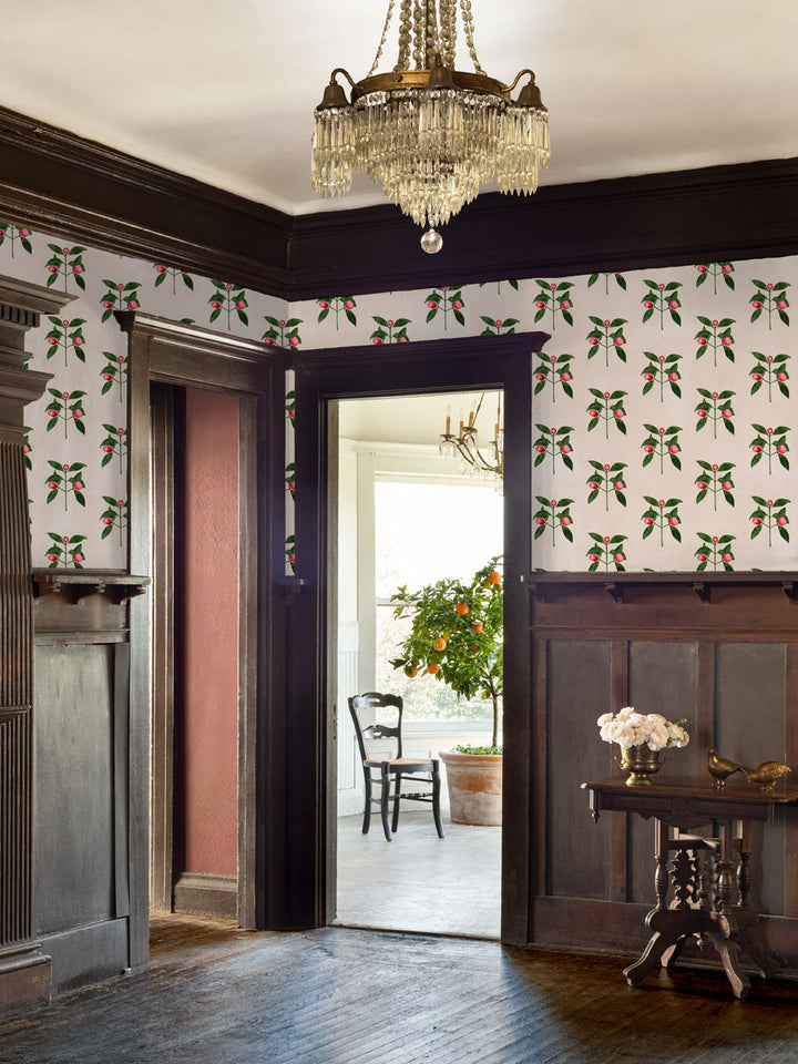 Raspberry flower wallpaper covering room walls with red berries and green leaves